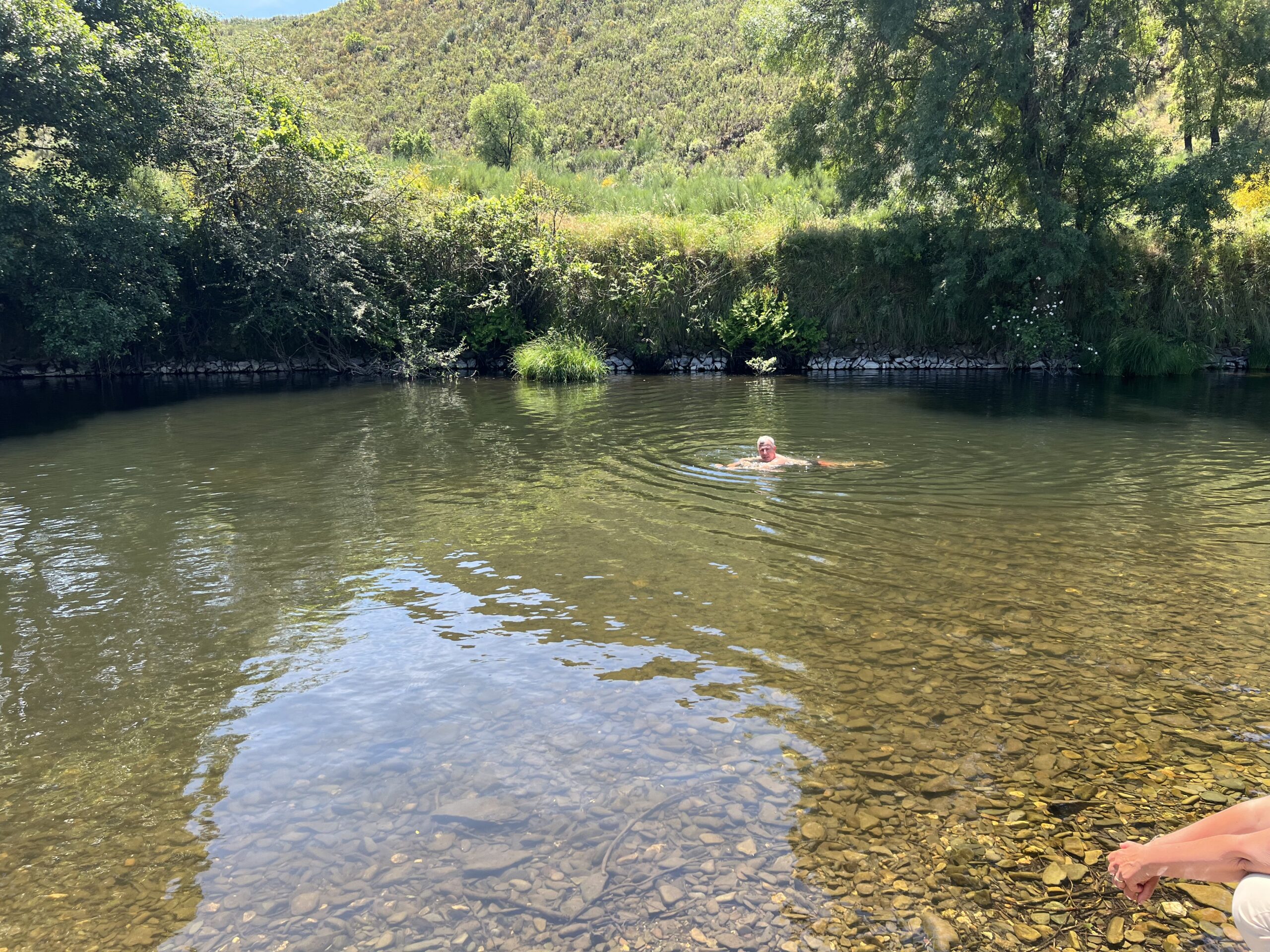 wild swimming clear lake portugal